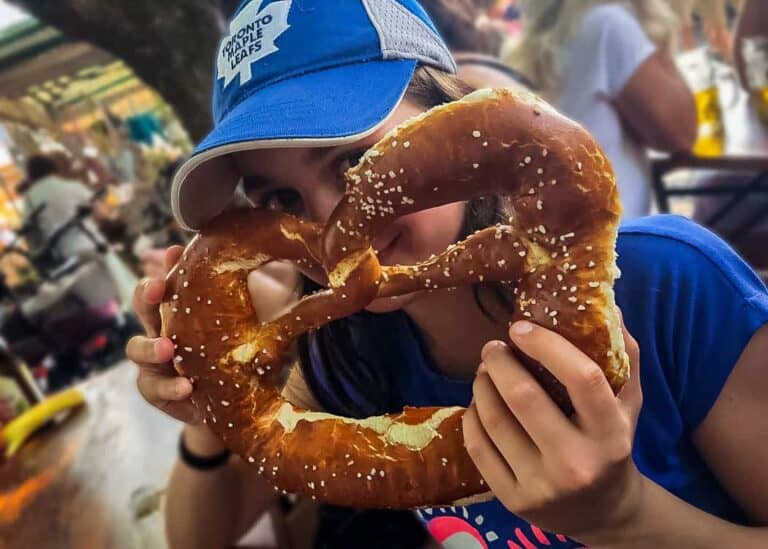 Munich- Daughter holding Huge Pretzel as big as her head