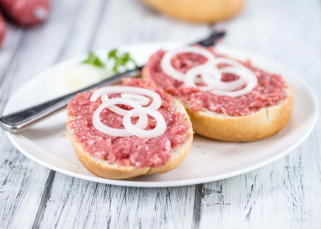 Mettwurst on a bun with onions