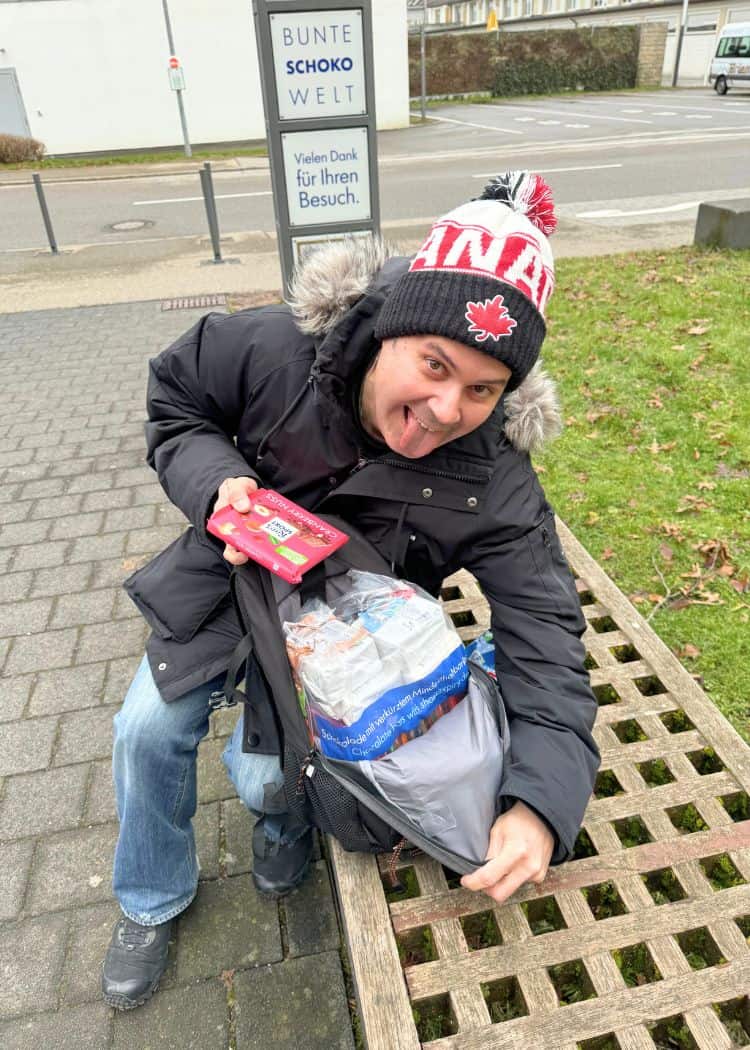 Hubby holding bag of chocolate that he bought