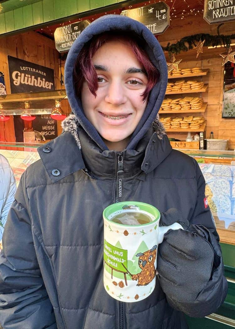Leipzig Christmas Market - Daughter drinking Kinderpunsch from special kids mug