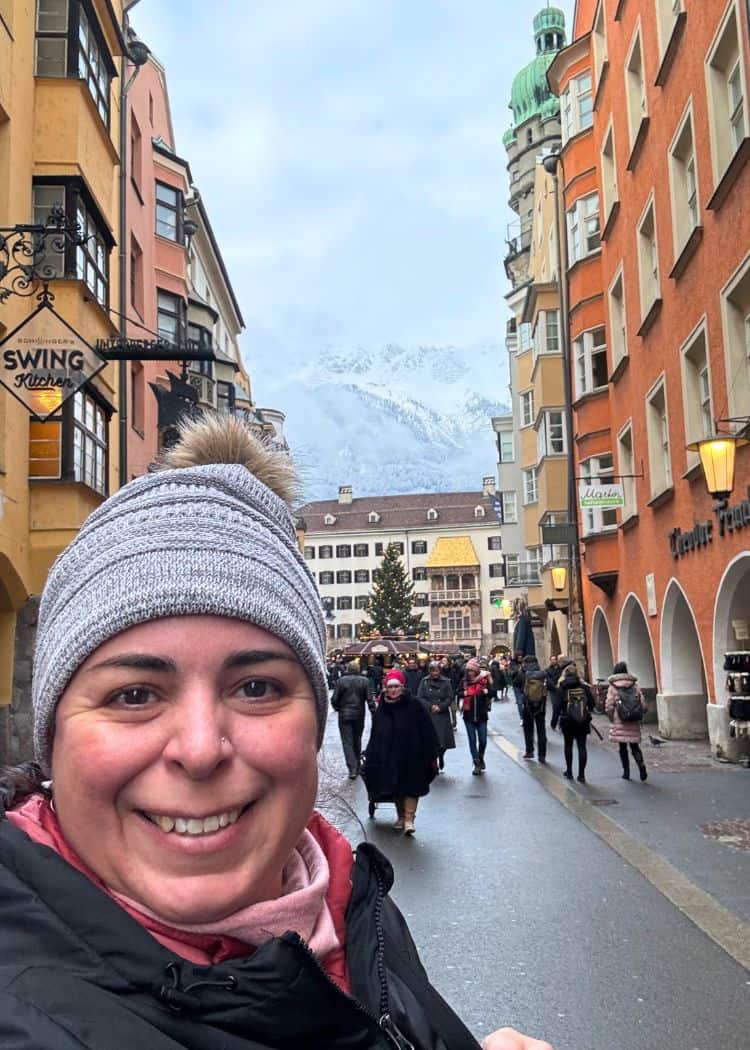 Innsbruck Christmas Markets - Me in the Old Town Market with the mountains a nd Golden Roof in the background