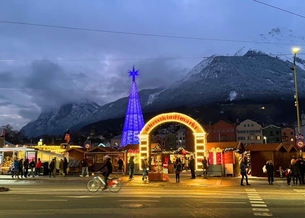 Innsbruck Christmas Markets - Swarovski Tree lit up at night with entrance to the Christkindlmarkt