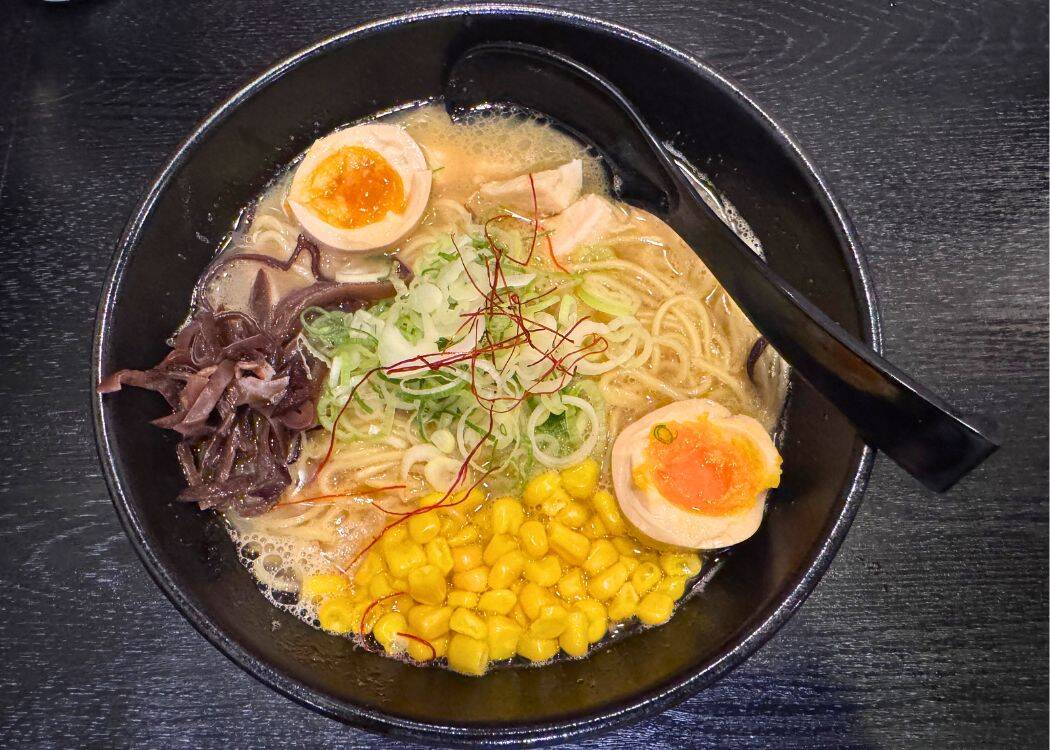 Delicious Bowl of Ramen in Black Bowl with Black Spoon