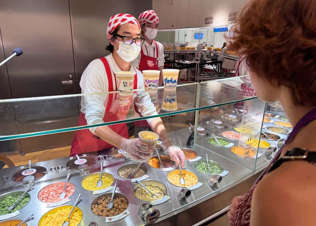 Yokohama - Daughter choosing her cup noodles ingredients at the Cup Noodle Museum